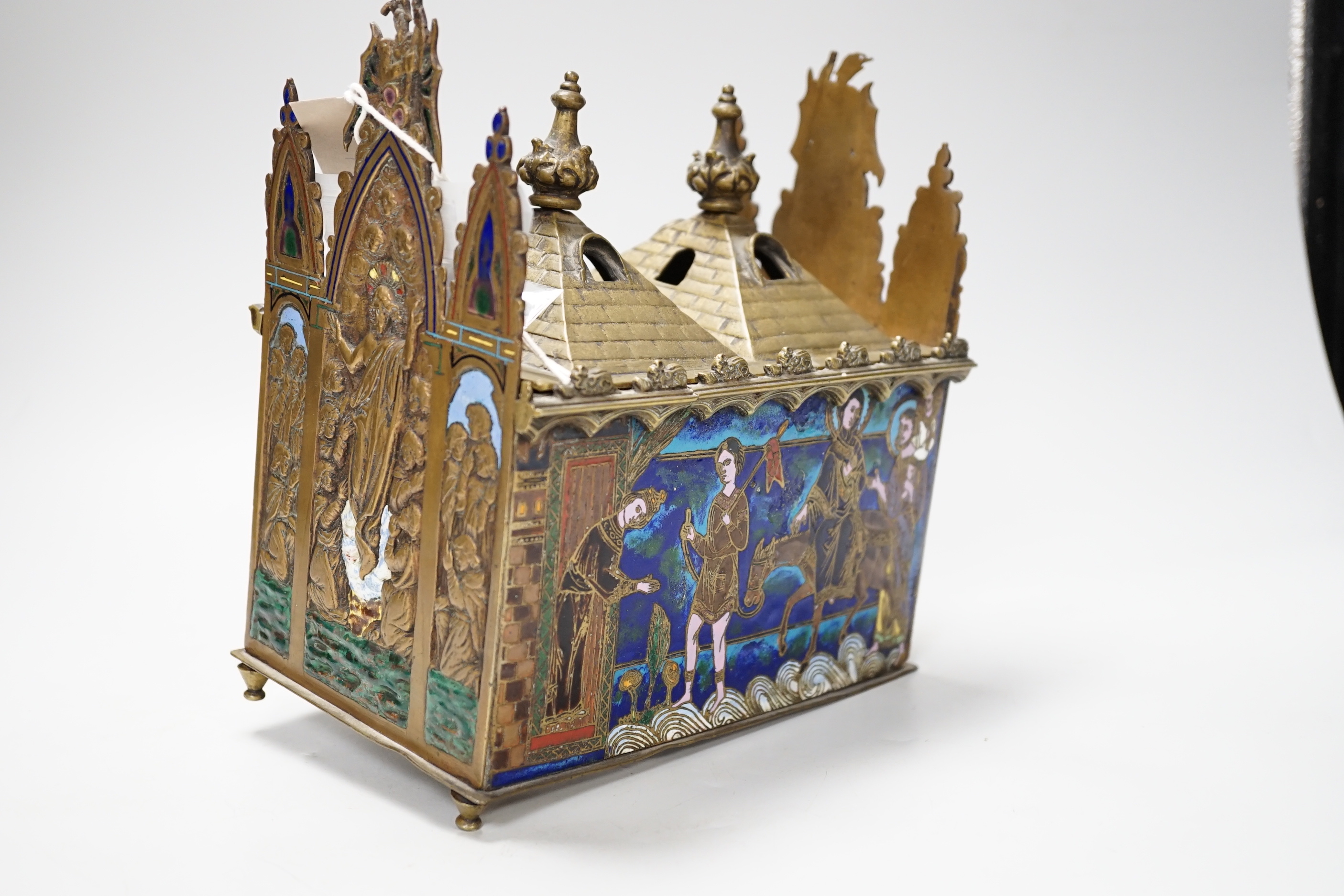 A late 19th century replica of a medieval brass and champleve enamel reliquary casket, 21.5cm high x 19cm wide